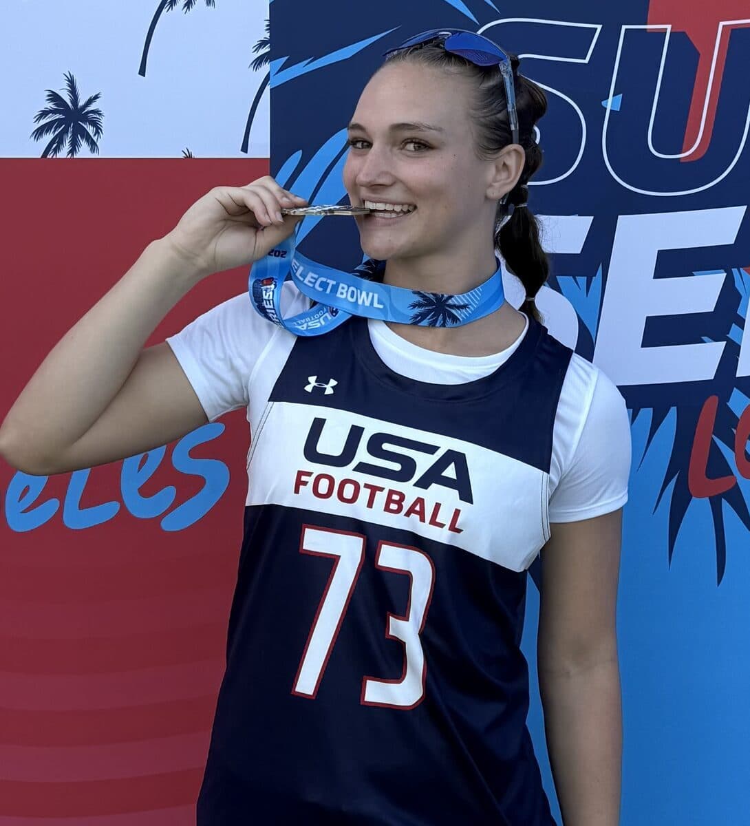 Tenley Hill biting her championship medal — USA Football Select Bowl 2025